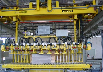 A transfer station using vacuum technology to handle sawn limestone elements